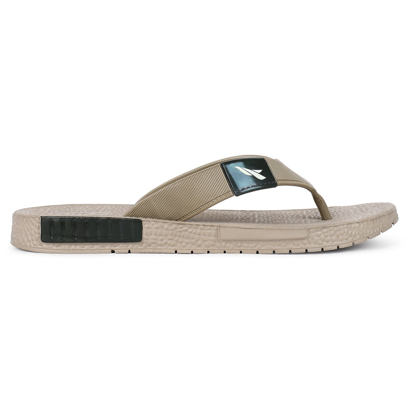 From back side right side view of image of Flite slippers.  The sandal has a textured, slightly bumpy footbed and a thick durable looking sole. The thong strap is wide an also textured with horizontal ridges. 