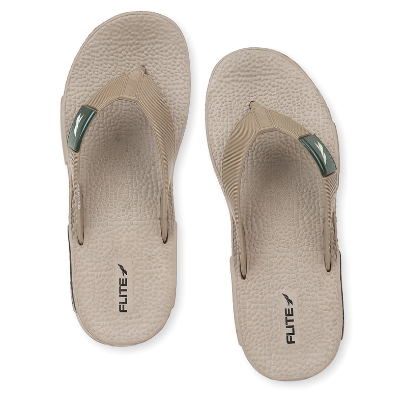 Front from back side image of A close up slight high angle shot of single color men's flip flop sandal by flite. The sandal has a textured, slightly bumpy footbed and a thick durable looking sole. The thong strap is wide an also textured with horizontal ridges. 