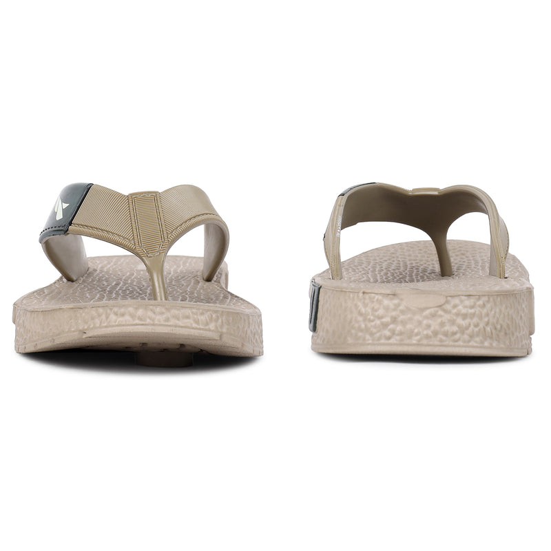 Front and back side image of A close up slight high angle shot of single color men's flip flop sandal by flite. The sandal has a textured, slightly bumpy footbed and a thick durable looking sole. The thong strap is wide an also textured with horizontal ridges. 