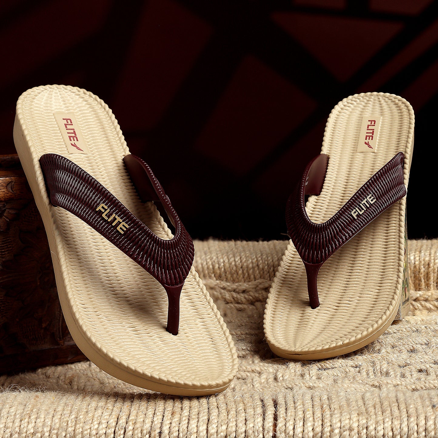 Two one by one Image of Flite Flip Flops For Women Slippers with brown strip on it. With white background the flip flop or slippers looks good like never before. 