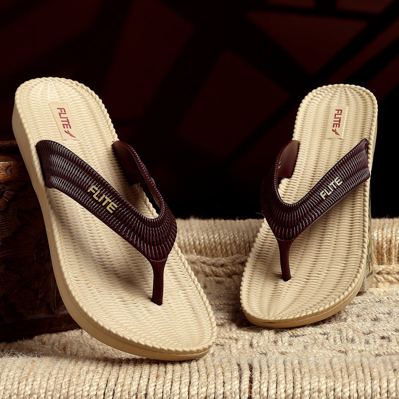 Two one by one Image of Flite Flip Flops For Women Slippers with brown strip on it. With white background the flip flop or slippers looks good like never before. 