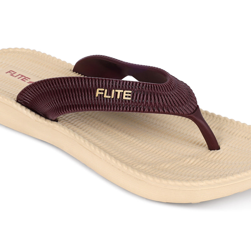 Image of Flite Flip Flops For Women Slippers with brown strip on it. With white background the flip flop or slippers looks good like never before. 