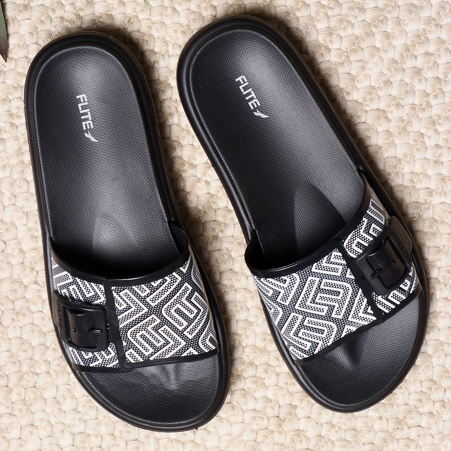 Fite Black Slides For Women with white print on it for everyday wear with white background. 