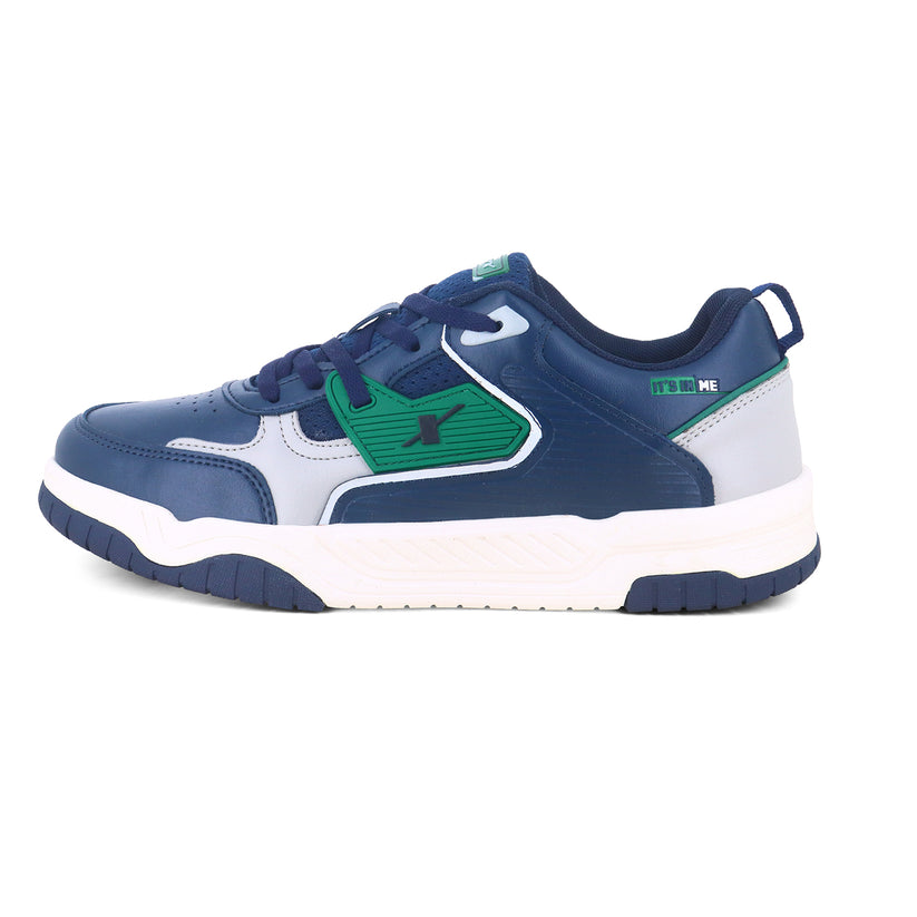 Left side image of Image of Sneakers for Men by Sparx , blue sneaker with green logo of sparx writing X on it and the bottom is white with non slip grip of blue comfortable to wear for men of all age and affordable. 