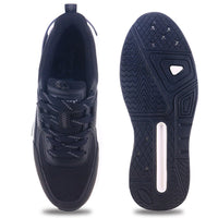 From up and down Image of black sparx shoes for men with white bottom and white background with shadow at the bottom which is comfortable to wear. 