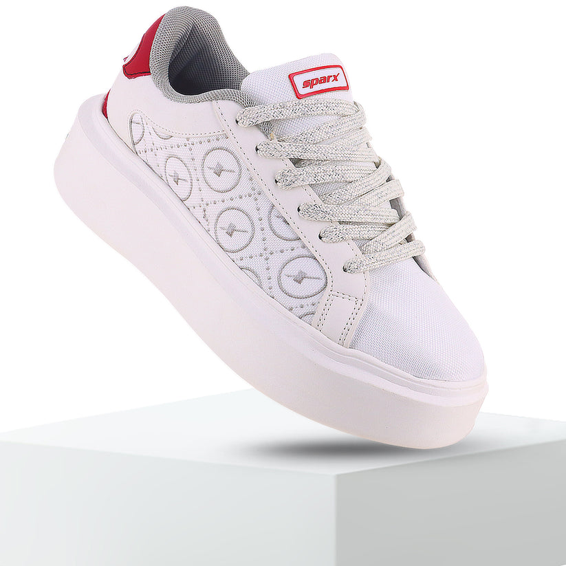 Side view of Attractive and beautiful white Sneakers for Men with X written on it. 