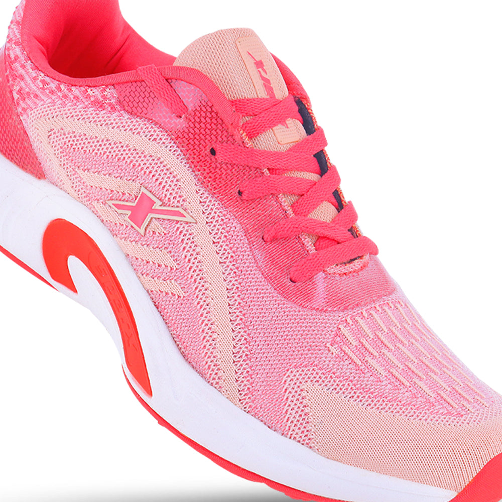 Zoom right side Image of women's athletic shoe in shades of pink and coral, with a white sole and a prominent "X" logo on the side. By Sparx and white background available.