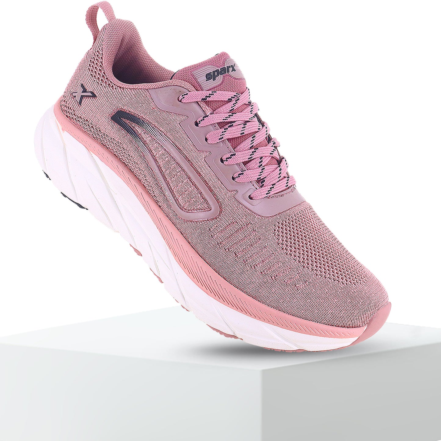 Pink white sparx shoes for women with logo visible and can be used for regular day to day activity and sports purpose. This image is available with white background