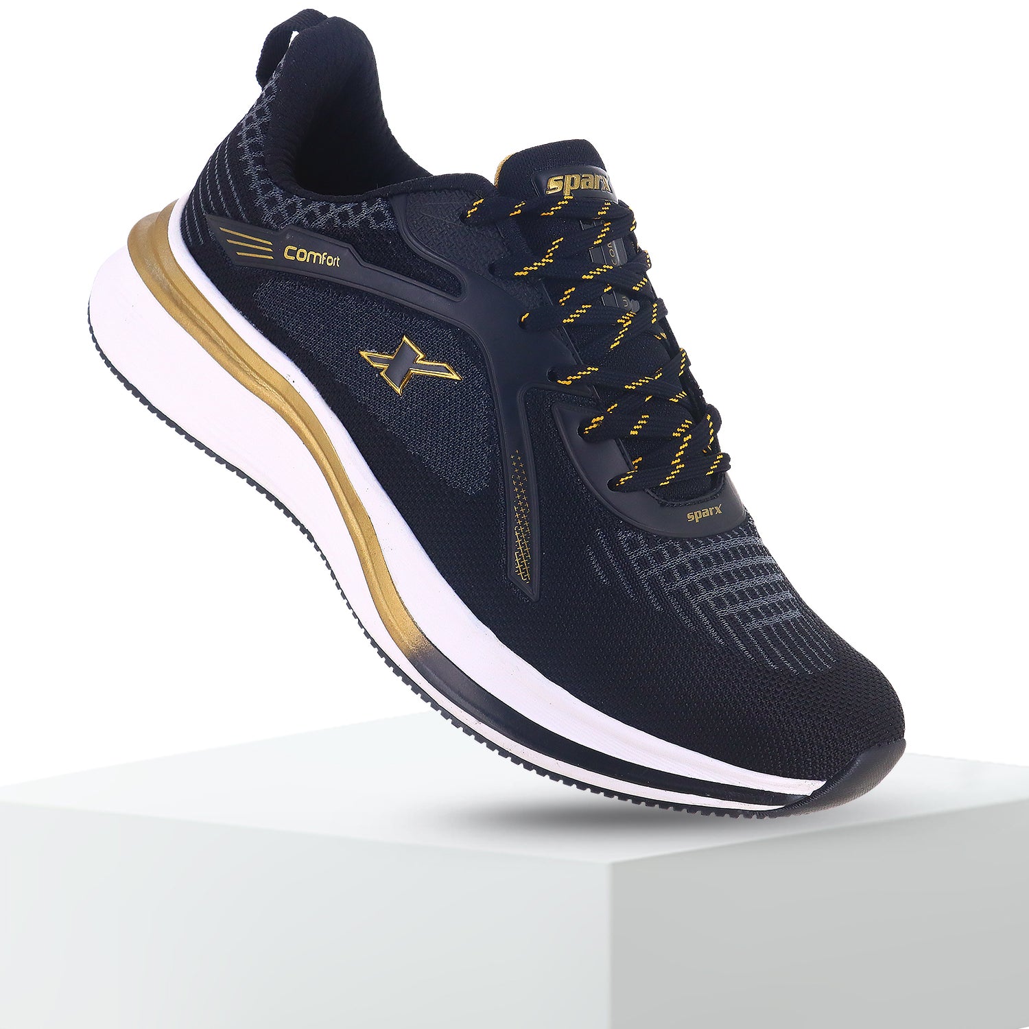 back side fly image - Sparx by Relaxo Black and gold sports running shoes with cushioned white sole and breathable mesh upper, designed for comfort and everyday athletic performance.